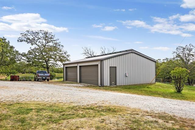 garage with a yard