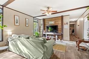 living room featuring hardwood / wood-style flooring and ceiling fan