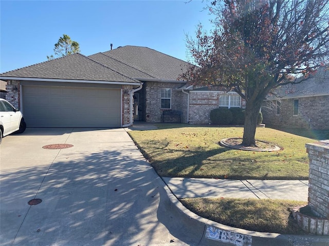 ranch-style home with a garage and a front yard