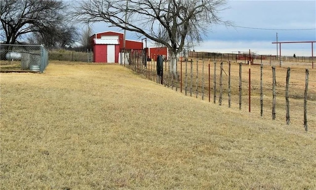 view of yard with a rural view