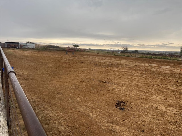 view of yard with a rural view