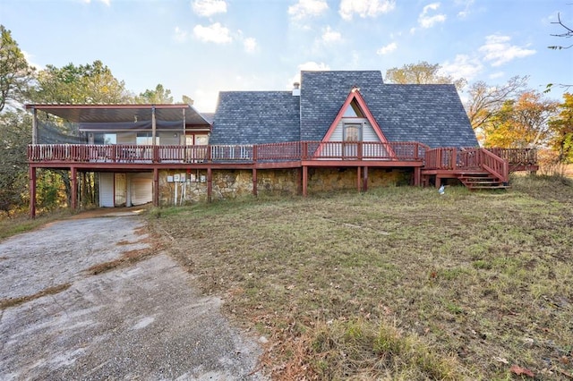 rear view of property with a deck