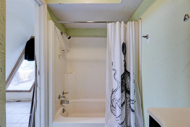 bathroom featuring tile patterned floors and shower / bath combo