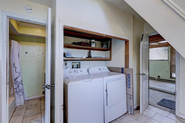 laundry room featuring washing machine and dryer