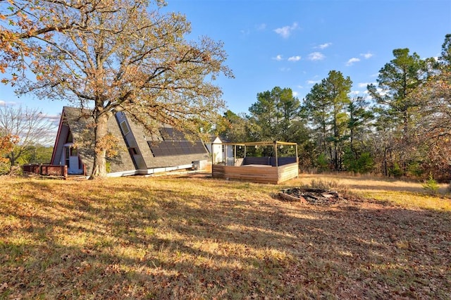 view of yard featuring a wooden deck