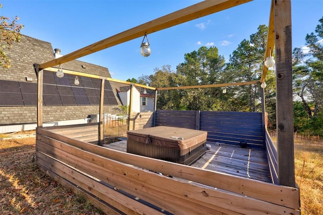 wooden terrace with a covered hot tub