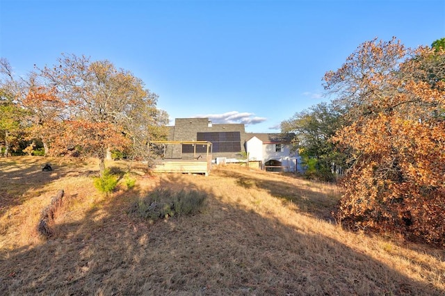 view of yard featuring a wooden deck