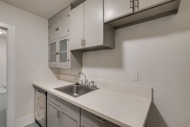 kitchen featuring stainless steel dishwasher and sink