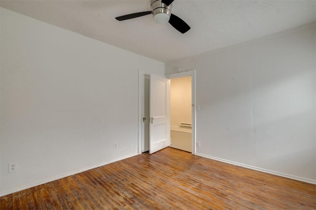 empty room with ceiling fan, light hardwood / wood-style floors, and baseboard heating