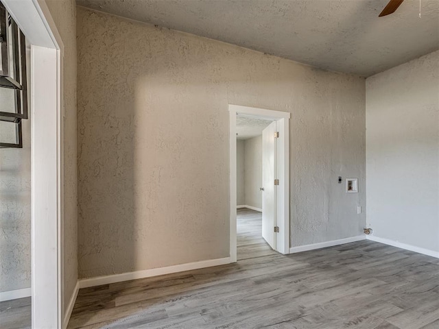 unfurnished room featuring hardwood / wood-style flooring and ceiling fan