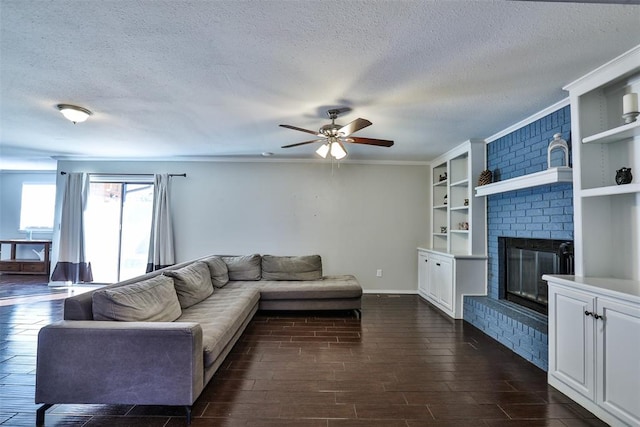 living room featuring a fireplace, dark wood-type flooring, and a textured ceiling