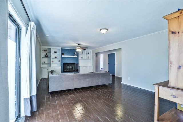 unfurnished living room featuring built in features, a fireplace, dark hardwood / wood-style floors, and ornamental molding