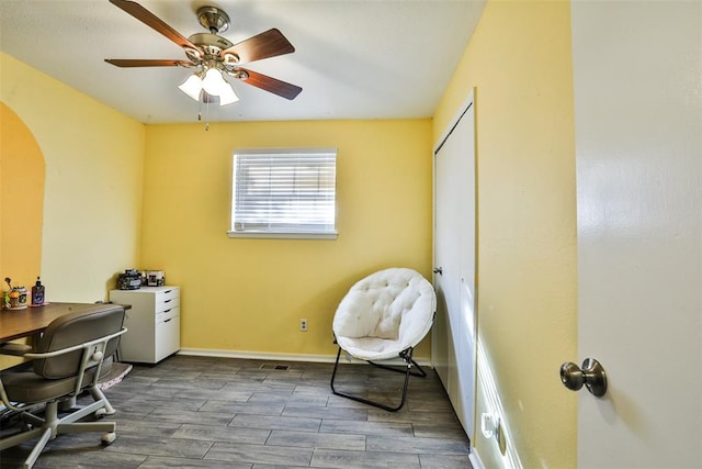 home office featuring ceiling fan and wood-type flooring