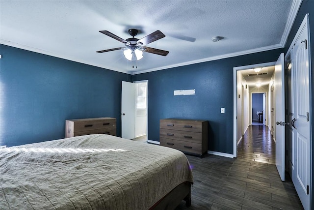 bedroom with ceiling fan, dark wood-type flooring, a textured ceiling, and ornamental molding