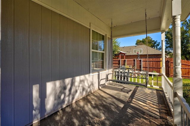 wooden terrace with a porch