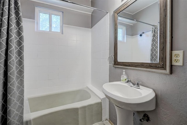 bathroom featuring shower / bath combo with shower curtain