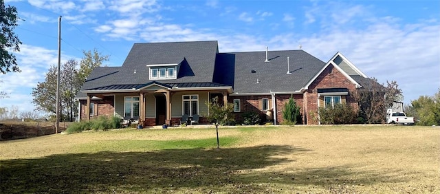 craftsman inspired home with a porch and a front lawn