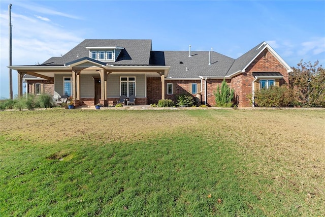 craftsman inspired home featuring a front lawn and covered porch