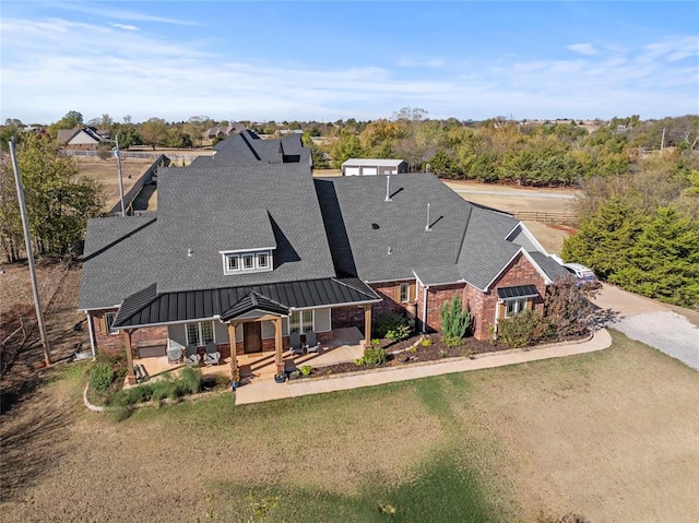 back of property with a patio and a lawn