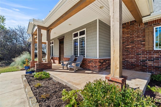 view of patio featuring a porch