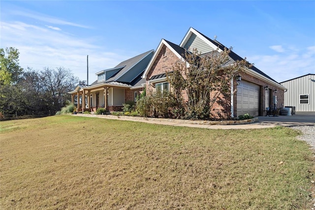 view of side of home with a lawn, central air condition unit, a porch, and a garage