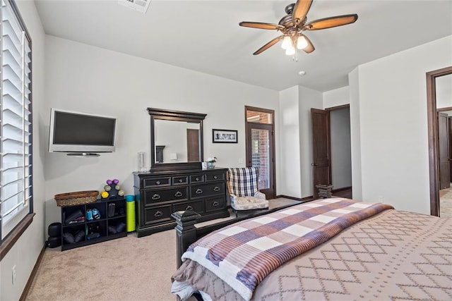 bedroom with light carpet and ceiling fan