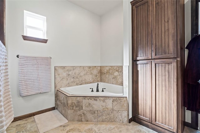 bathroom featuring tiled tub