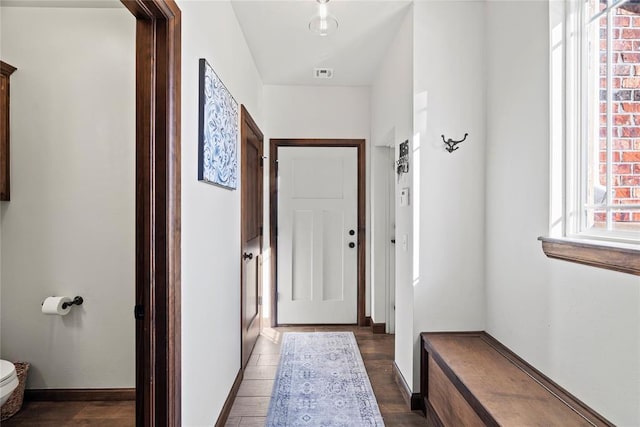 hall featuring dark wood-type flooring