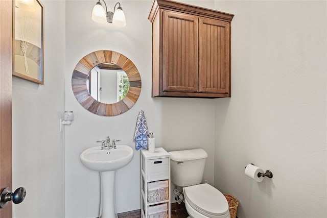 bathroom with sink and toilet