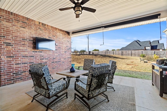 view of patio featuring ceiling fan