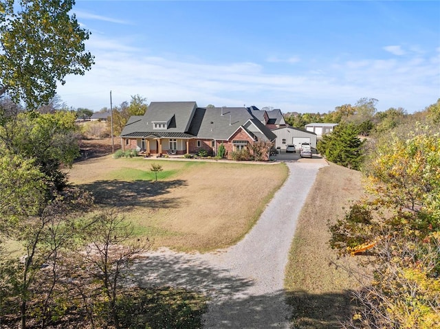 view of front of home with covered porch and a front yard