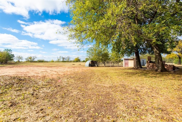 view of yard with a rural view