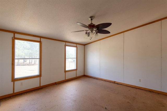 spare room with a textured ceiling and ceiling fan