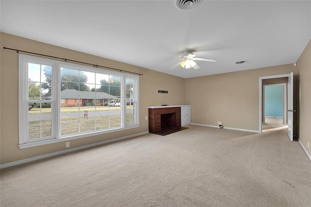 unfurnished living room with light carpet and ceiling fan