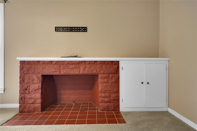 details featuring carpet flooring and a fireplace