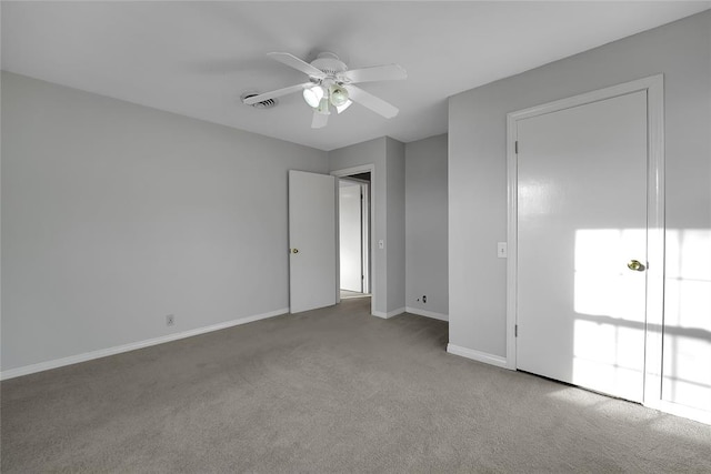 spare room with light carpet and ceiling fan