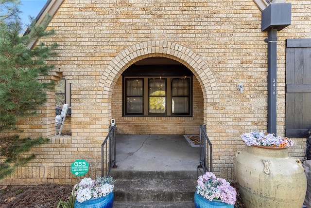 entrance to property with brick siding