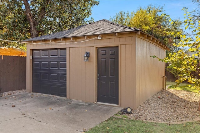 view of outbuilding with an outbuilding and fence