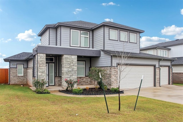 view of front of house featuring a front yard and a garage