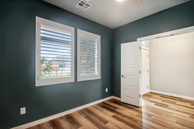 2200 El Cajon St, Edmond, OK 73034 - unfurnished bedroom with wood finished floors and baseboards