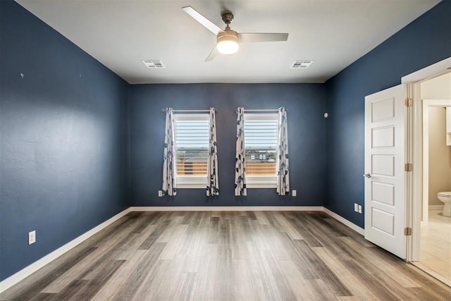 2200 El Cajon St, Edmond, OK 73034 - spare room featuring a ceiling fan and wood finished floors