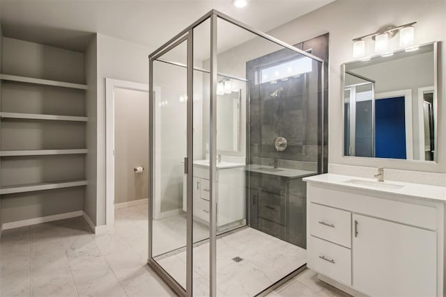 2200 El Cajon St, Edmond, OK 73034 - bathroom featuring marble finish floors, two vanities, and a shower stall