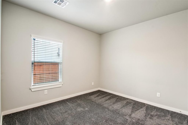 2200 El Cajon St, Edmond, OK 73034 - empty room with dark colored carpet and baseboards
