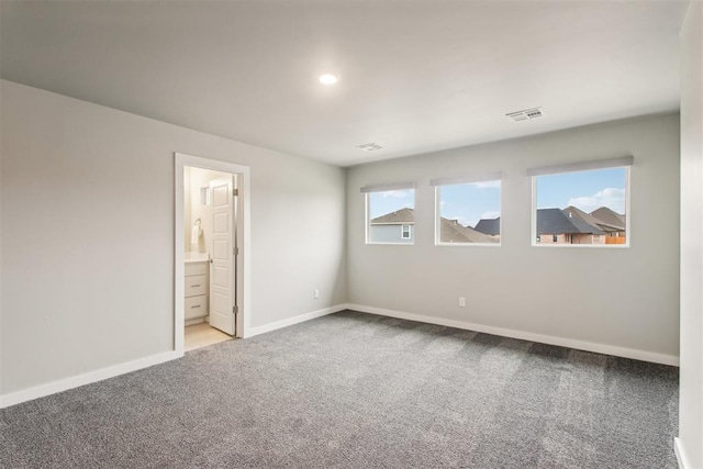 2200 El Cajon St, Edmond, OK 73034 - carpeted spare room with baseboards and recessed lighting