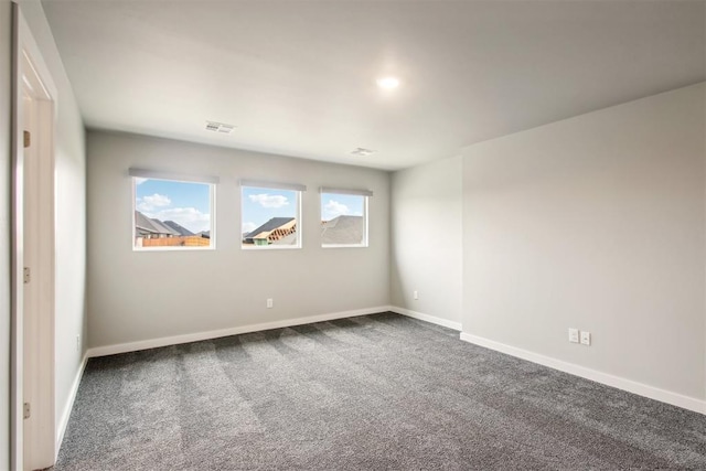 2200 El Cajon St, Edmond, OK 73034 - unfurnished room with dark carpet and baseboards