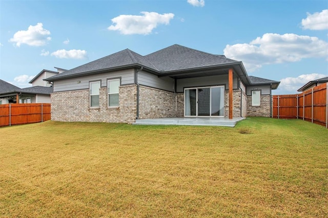 2200 El Cajon St, Edmond, OK 73034 - rear view of house with a fenced backyard, a patio area, brick siding, and roof with shingles