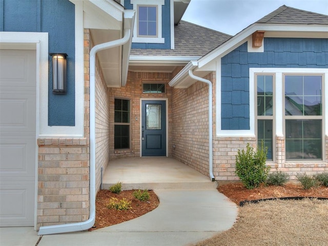 doorway to property featuring a garage