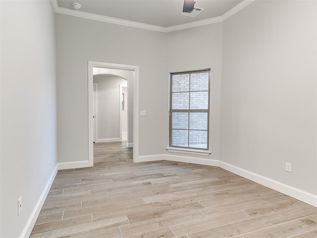 spare room with light hardwood / wood-style floors and ornamental molding