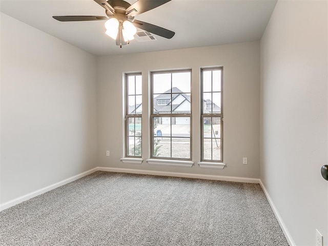 carpeted empty room with ceiling fan