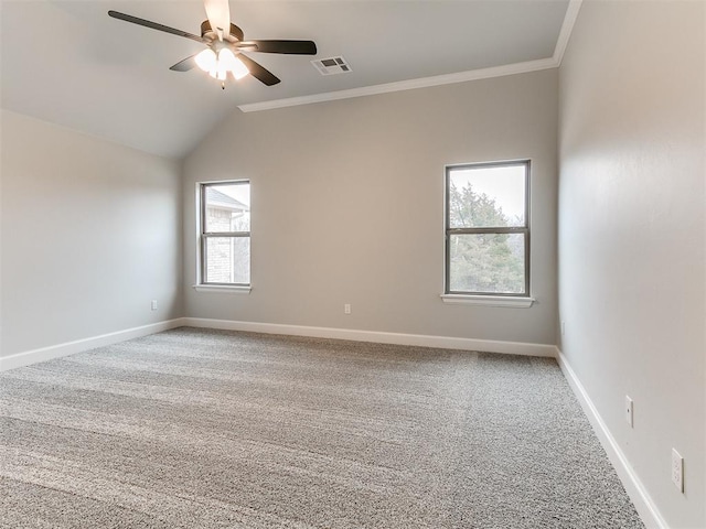 carpeted empty room featuring ceiling fan, lofted ceiling, and crown molding